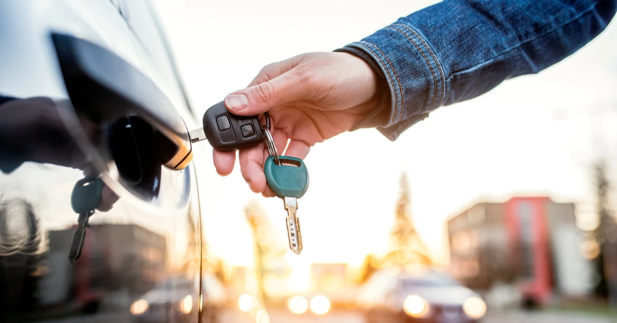 A close-up view of an opened modern car key showing the internal transponder microchip that communicates with a vehicle's immobiliser system.